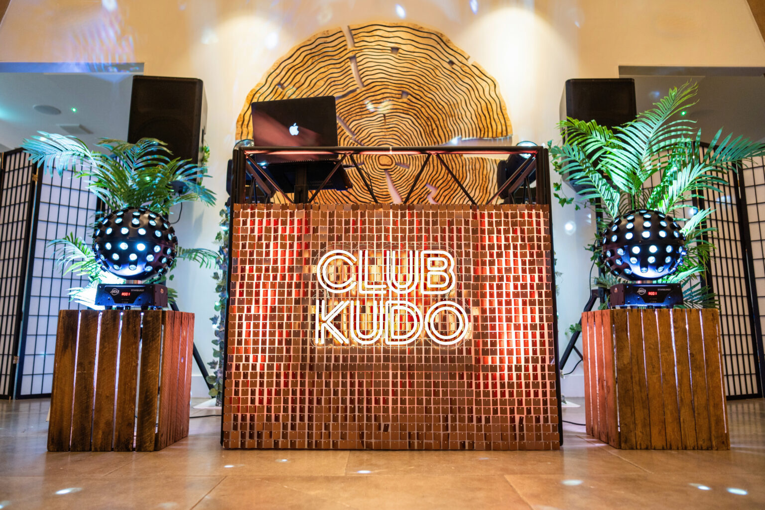 Sequin wall DJ booth with Club Kudo LED sign for modern wedding venues