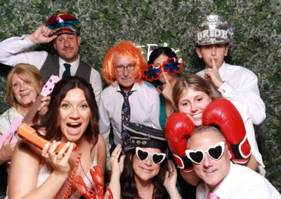 KudoBooth photobooth pictures from a wedding — guests with props
