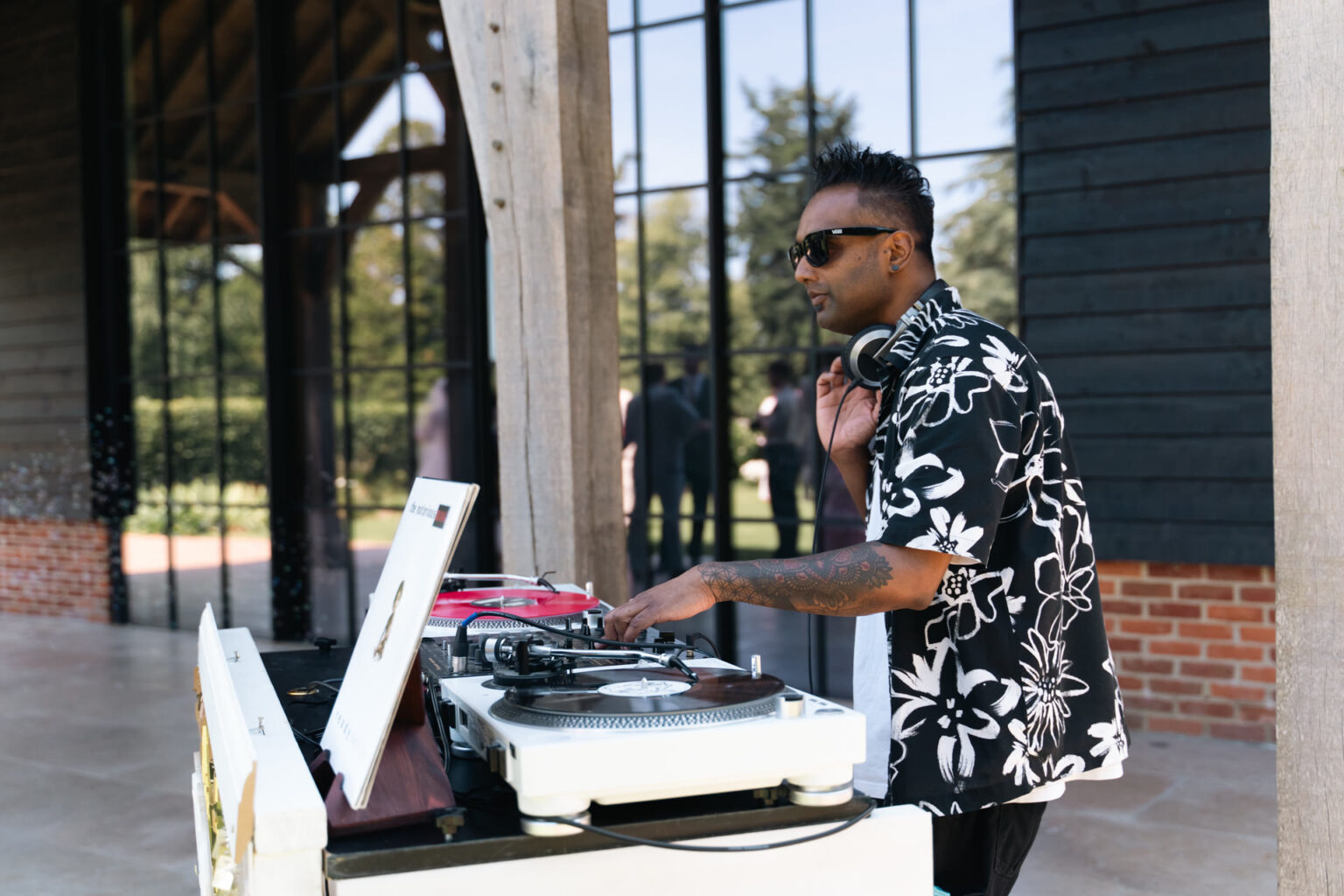 Club Kudo vinyl DJ package — DJ with turntables at a wedding reception