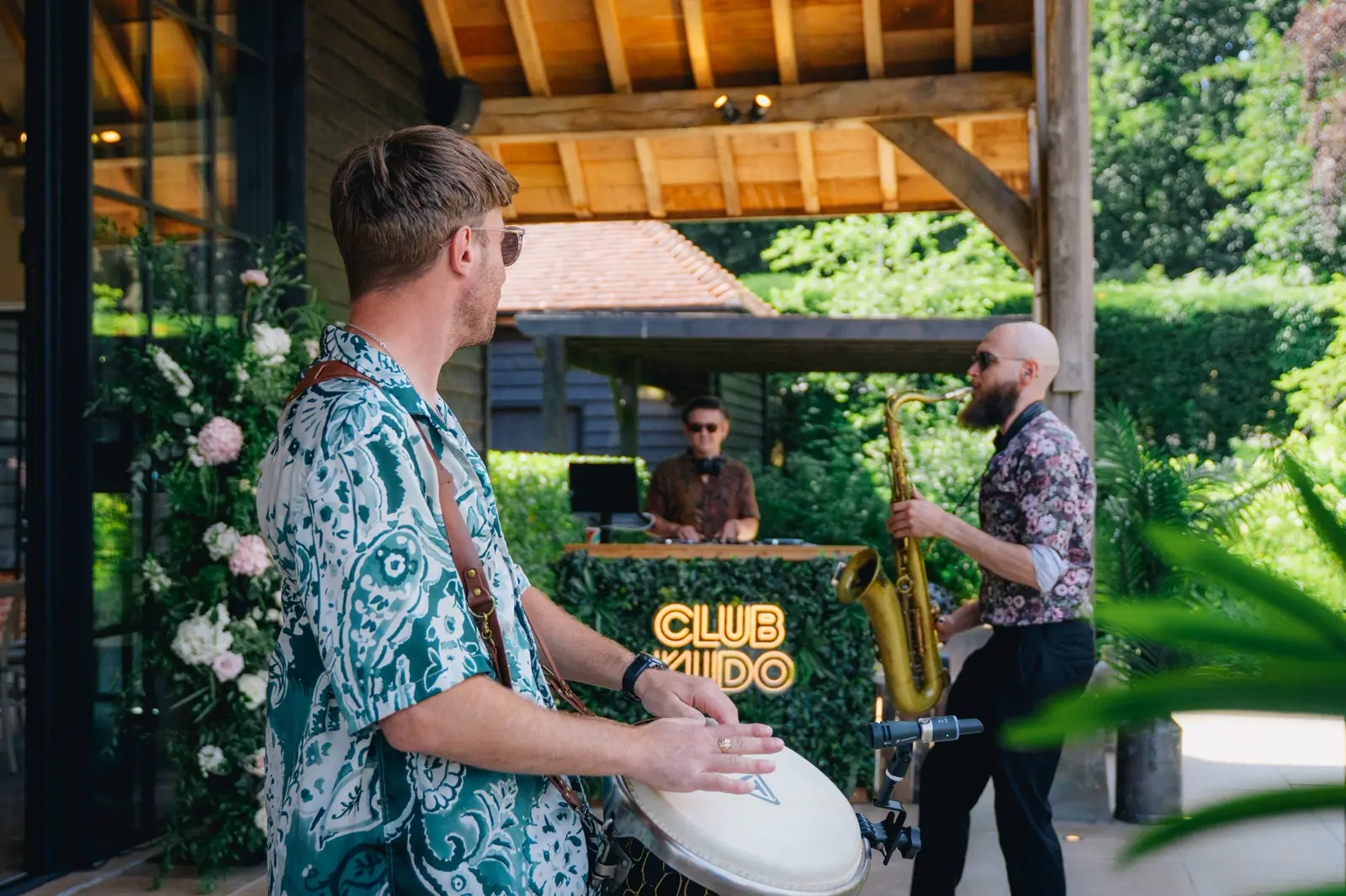 Club Kudo percussion and sax at the DJ booth at The Post Barn, Berkshire
