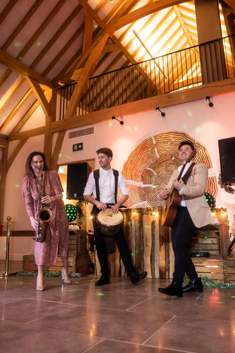 Club Kudo roaming acoustic trio performing live during wedding reception drinks