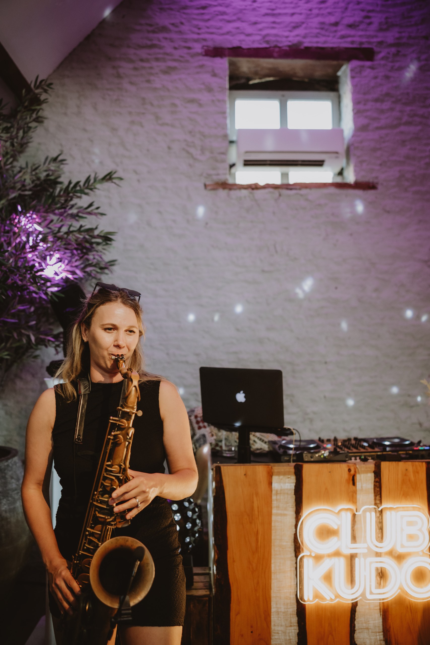 Live sax alongside the Club Kudo DJ booth at Stratton Court Barn