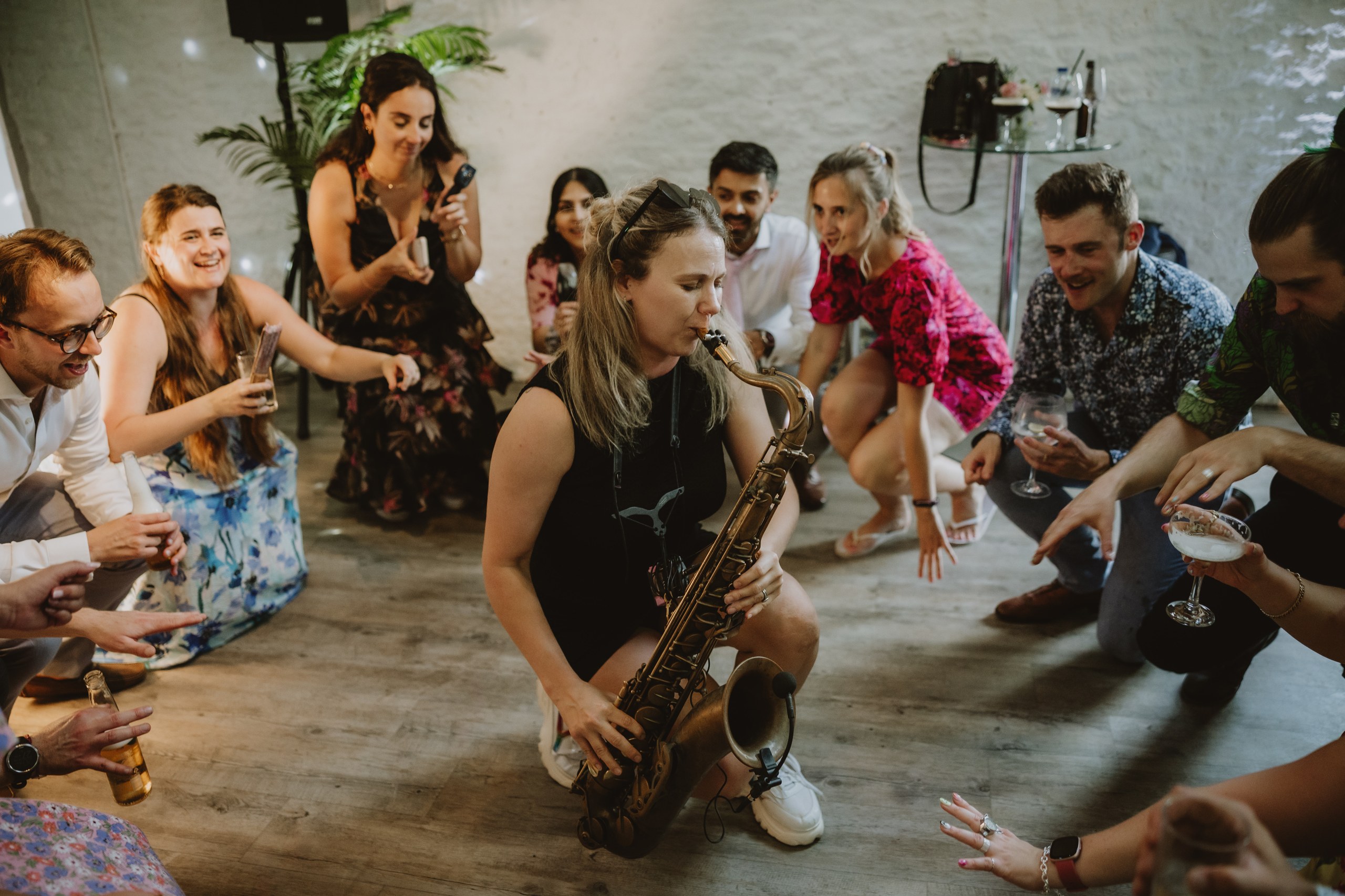 Wedding guests joining in with live sax on the Stratton dance floor