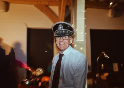 Wedding guest in a cap posing at the Club Kudo photo booth