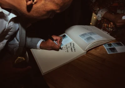 Photo booth guestbook filled with prints and messages