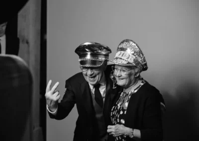 Older couple laughing at the Club Kudo photo booth